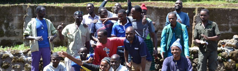 SENE porters and mountain guide. Celebration after climb. Group photo by Nick Prowse