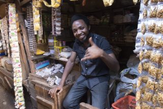 Tanzanian seller in Moshi local market. Photo © David Casartelli